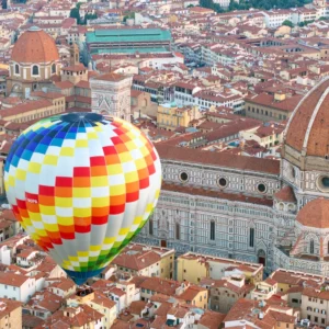 hot air balloon flying over florence and the duomo