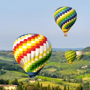 balloons over tuscan countryside