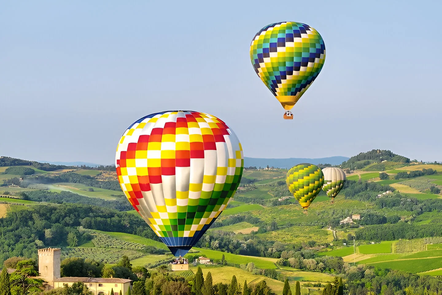 balloons over tuscan countryside