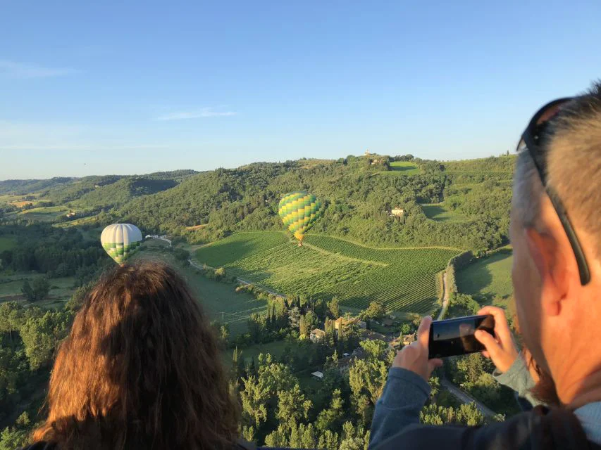 people watching hot air balloons