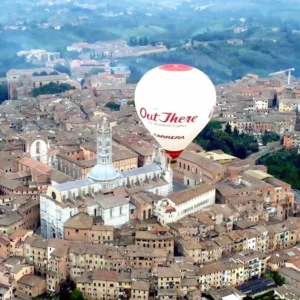 hot air balloon over the city of Siena