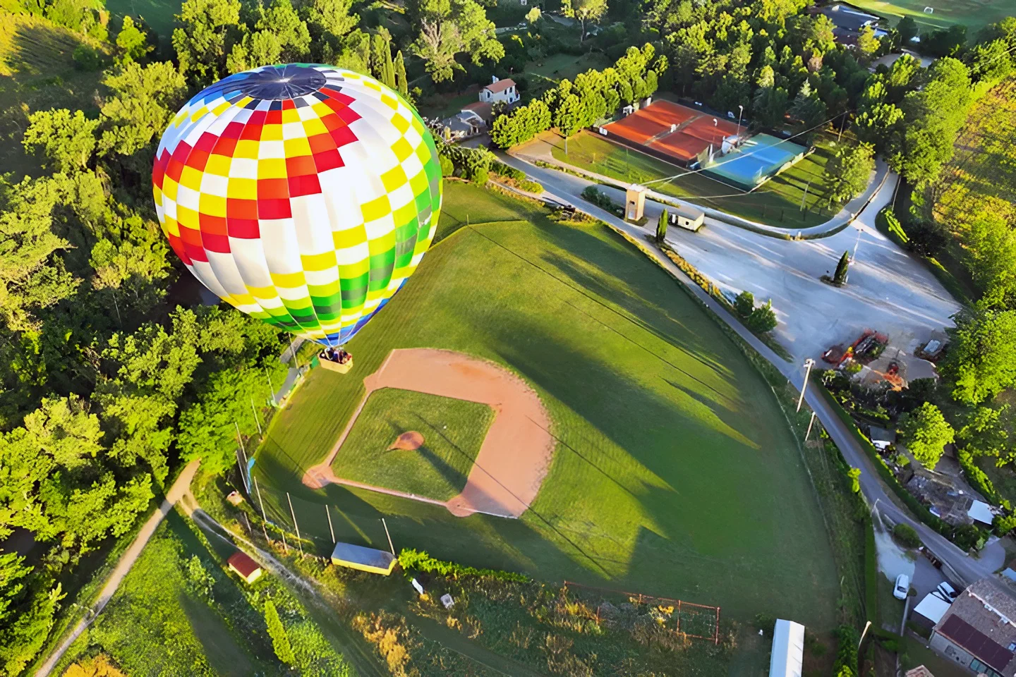 Hot air balloon over baseball field