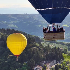 Panoramic view of the Chianti Valle from above with a Hot Air Balloon at sunrise