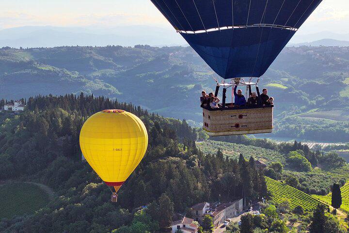 Panoramic view of the Chianti Valle from above with a Hot Air Balloon at sunrise